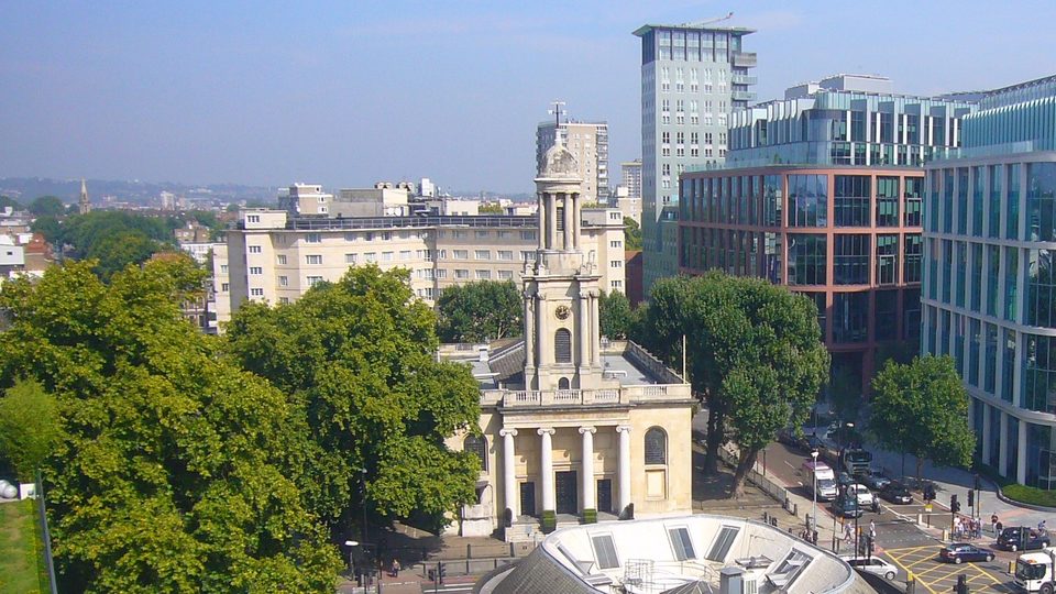 A high view over Euston Road towards the glass towers of Regent's Place in London, home of the GMC's London office